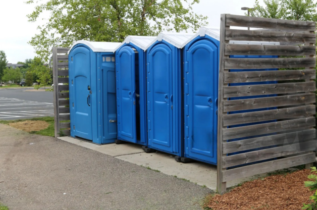 Row of blue portable toilets